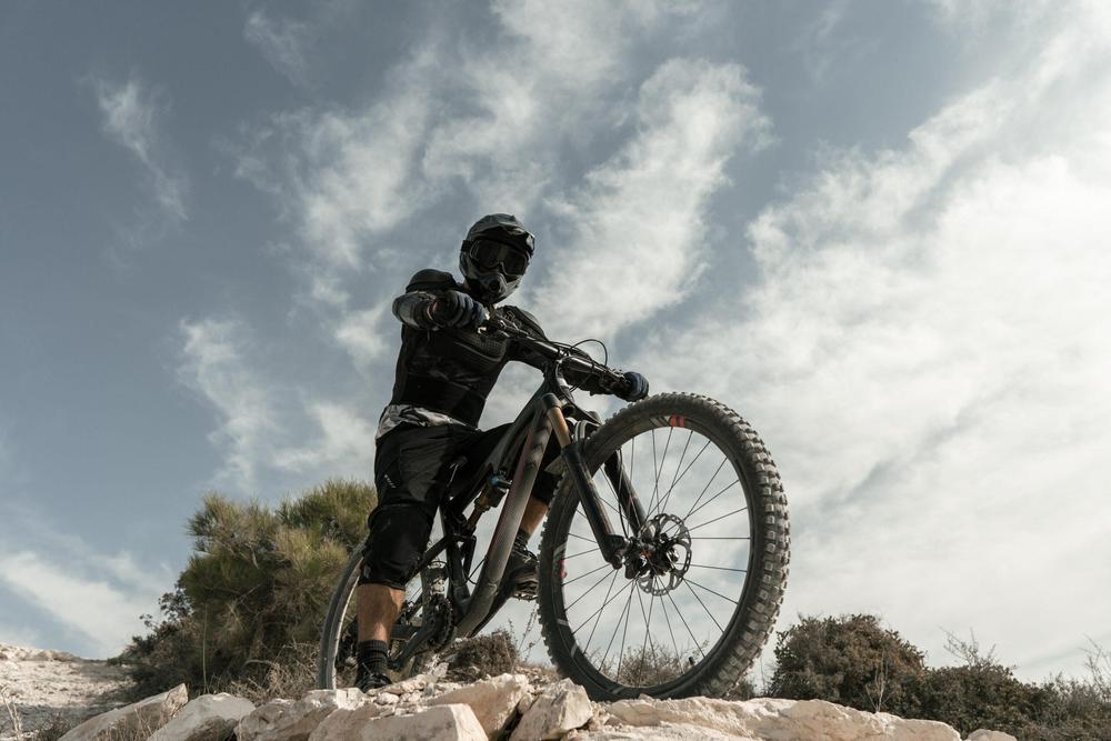 man-riding-mountain-bike-low-angle-scaled
